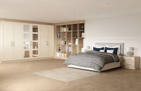 spacious bedroom with shelves and wardrobes 